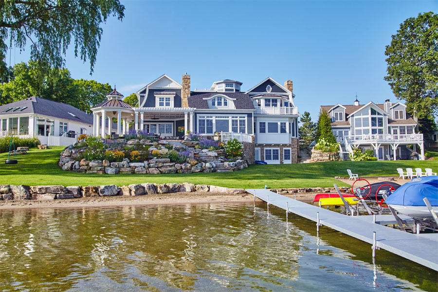 Luxurious Lakeside Residence with Manicured Gardens and Dock View