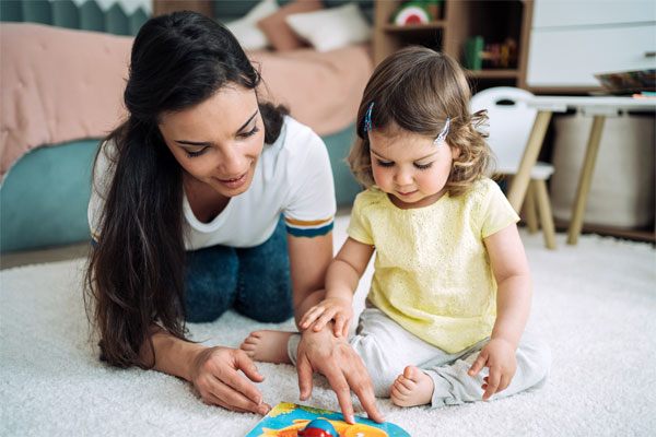 Mother playing with infant
